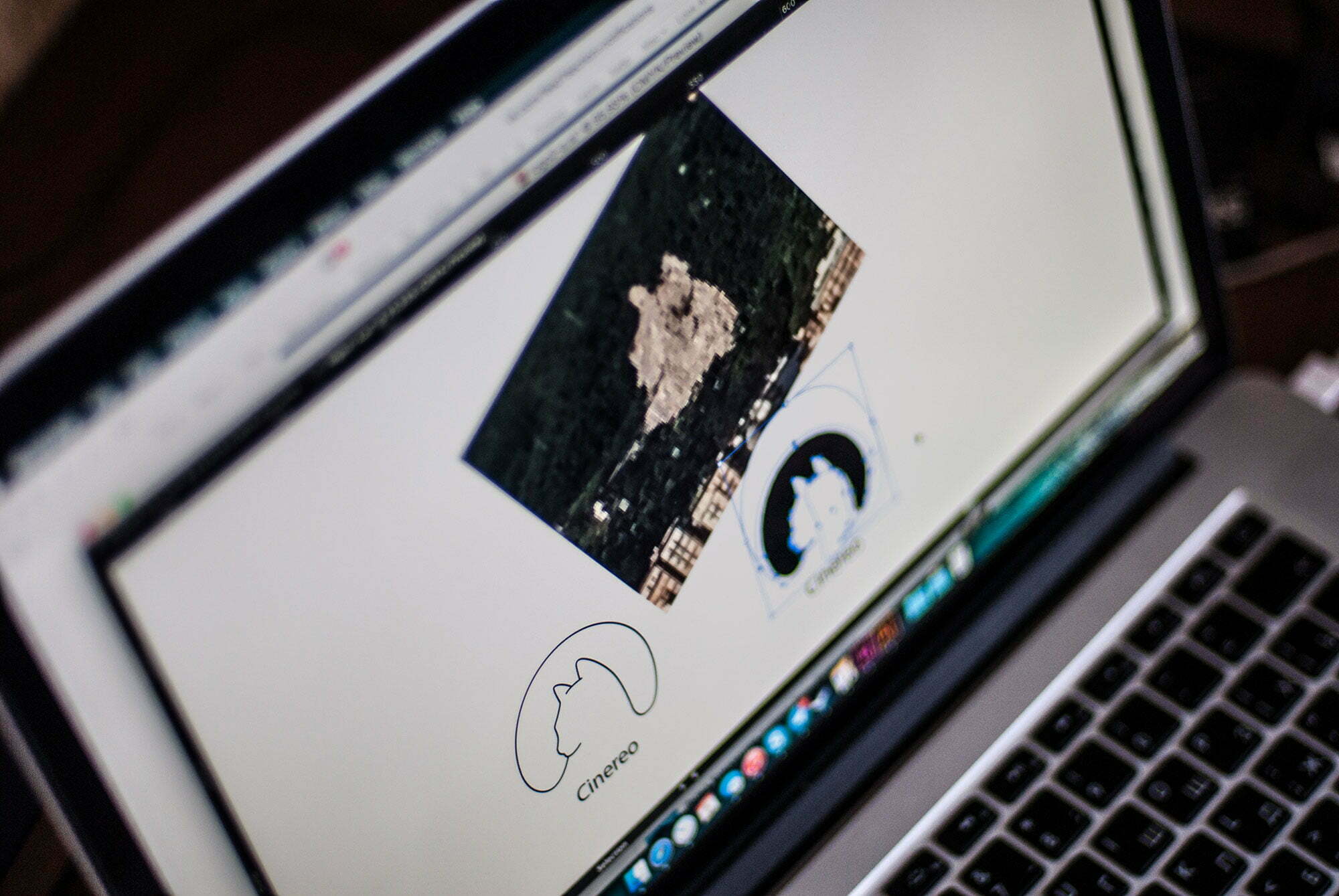Early logo design process — tracing the cat silhouette from a satellite image of the mountain