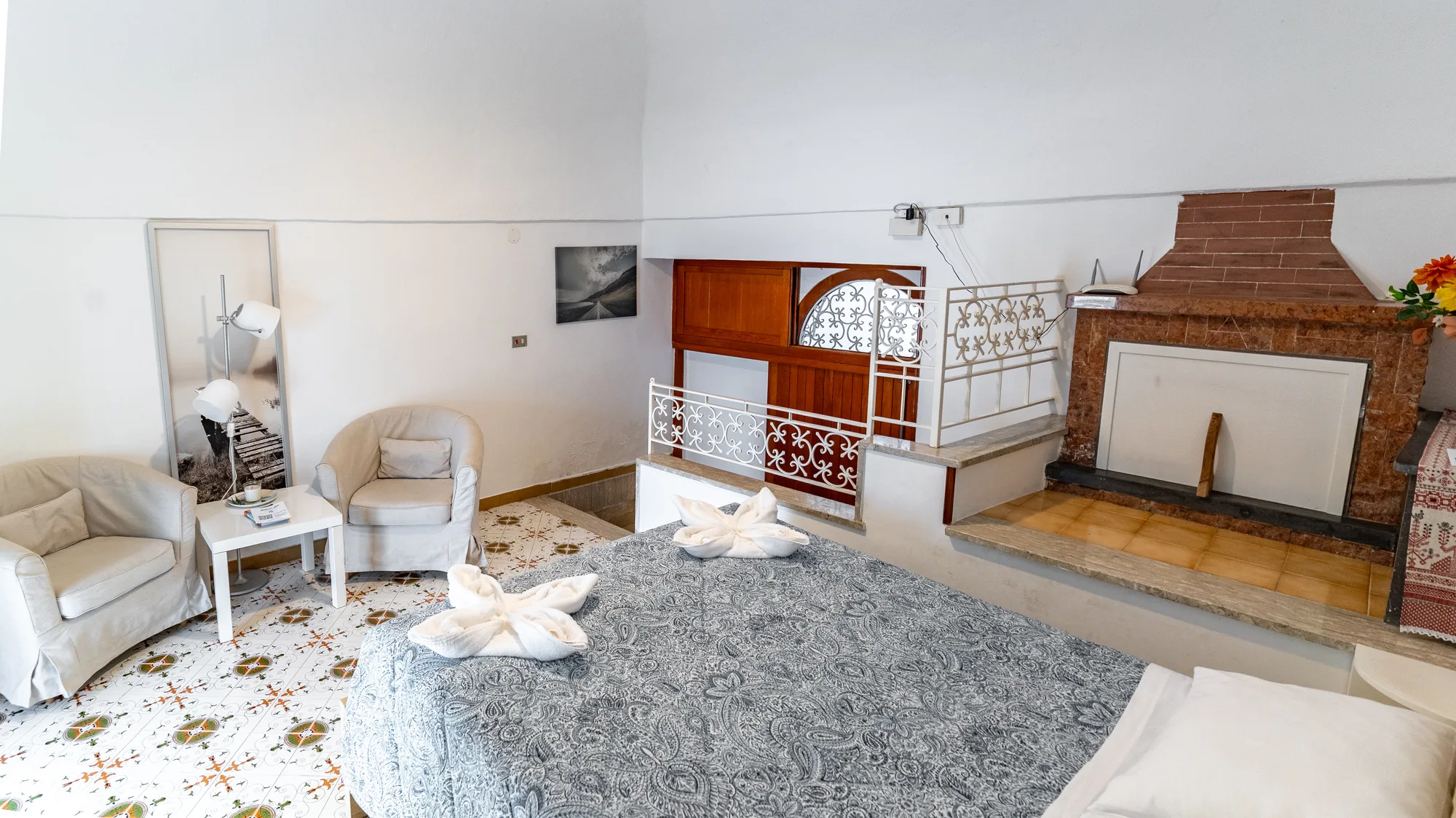 Interior view with armchairs, fireplace and authentic local character - interior photography on the Amalfi Coast by Cinereo