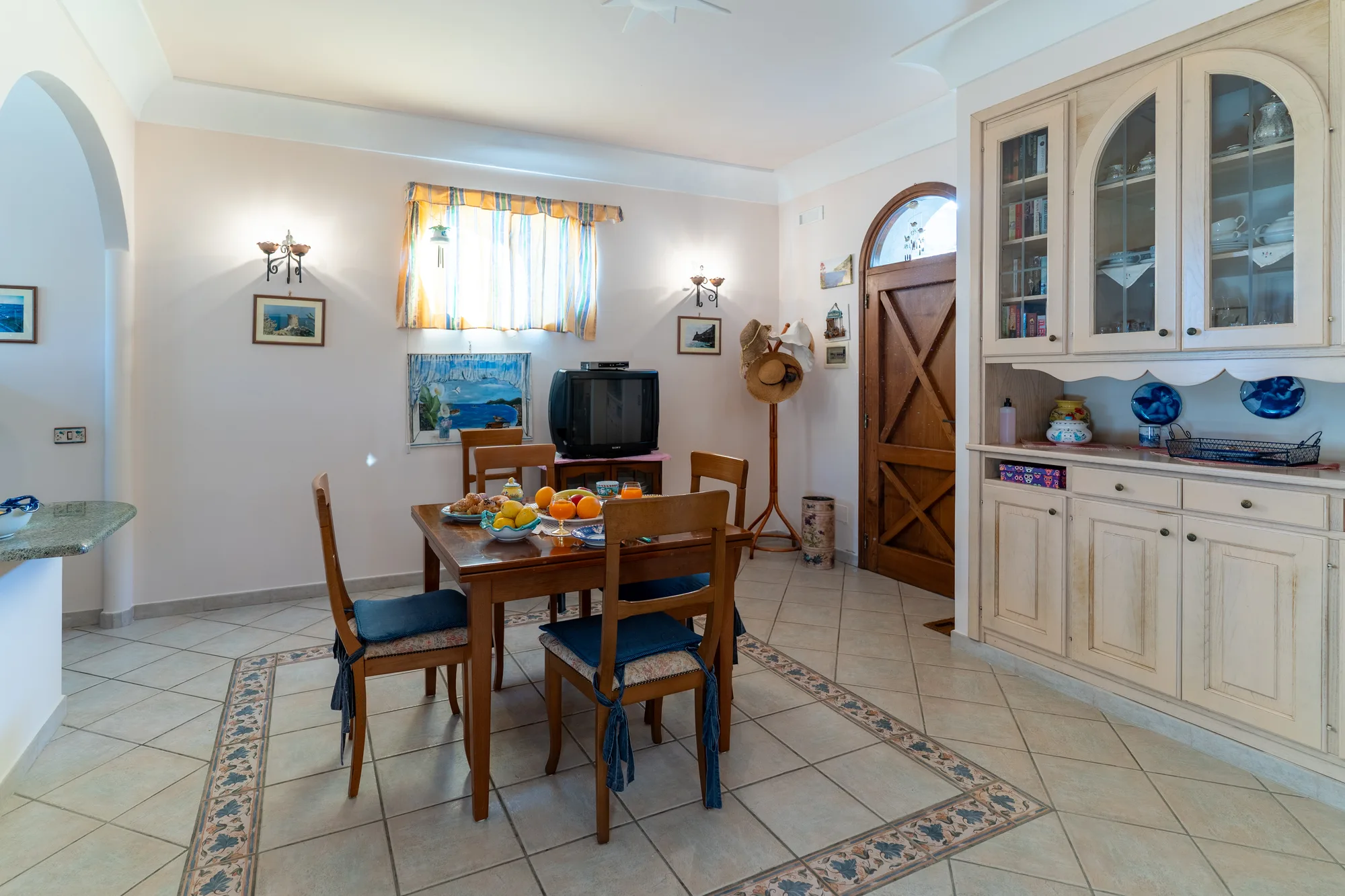 Bright living and dining room prepared for a vacation rental listing - interior photography on the Amalfi Coast by Cinereo