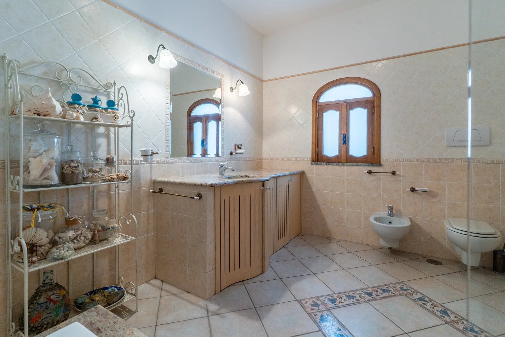Clean tiled bathroom photographed clearly for guest expectations - interior photography on the Amalfi Coast by Cinereo