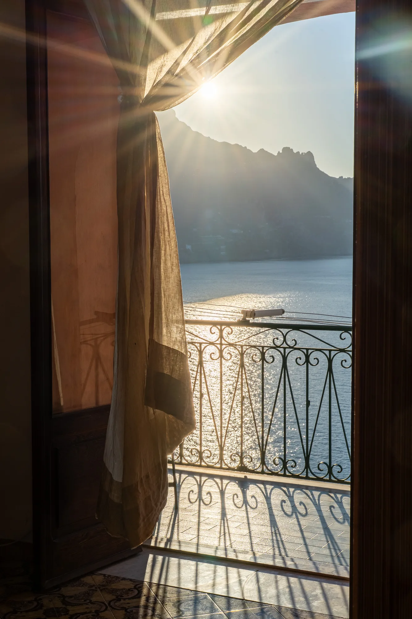 Sun flare detail from the balcony door - interior photography on the Amalfi Coast by Cinereo