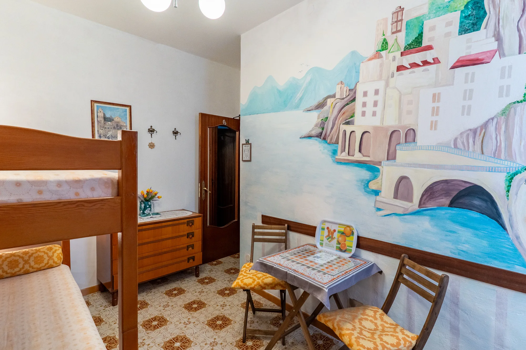 Guest room composition with painted Atrani wall detail - interior photography on the Amalfi Coast by Cinereo