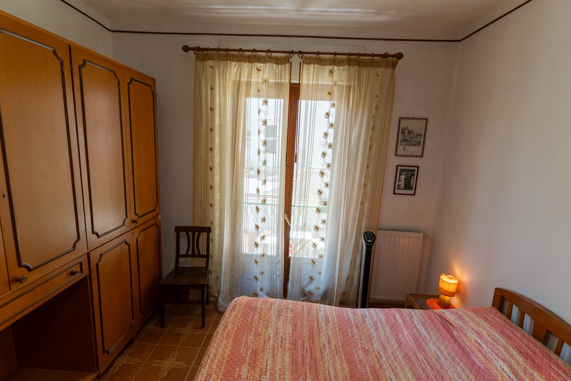 Wardrobe and window angle showing storage and room depth - interior photography on the Amalfi Coast by Cinereo