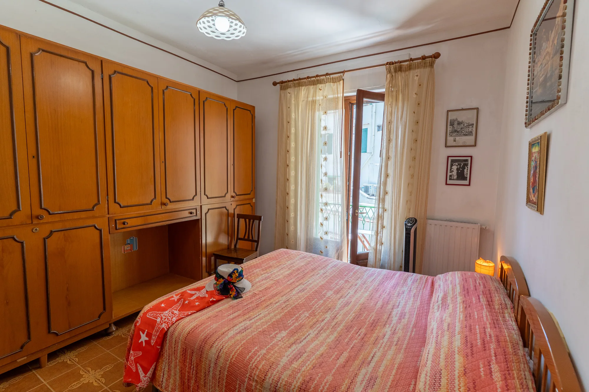 Balanced room composition with bed, wardrobe and filtered daylight - interior photography on the Amalfi Coast by Cinereo