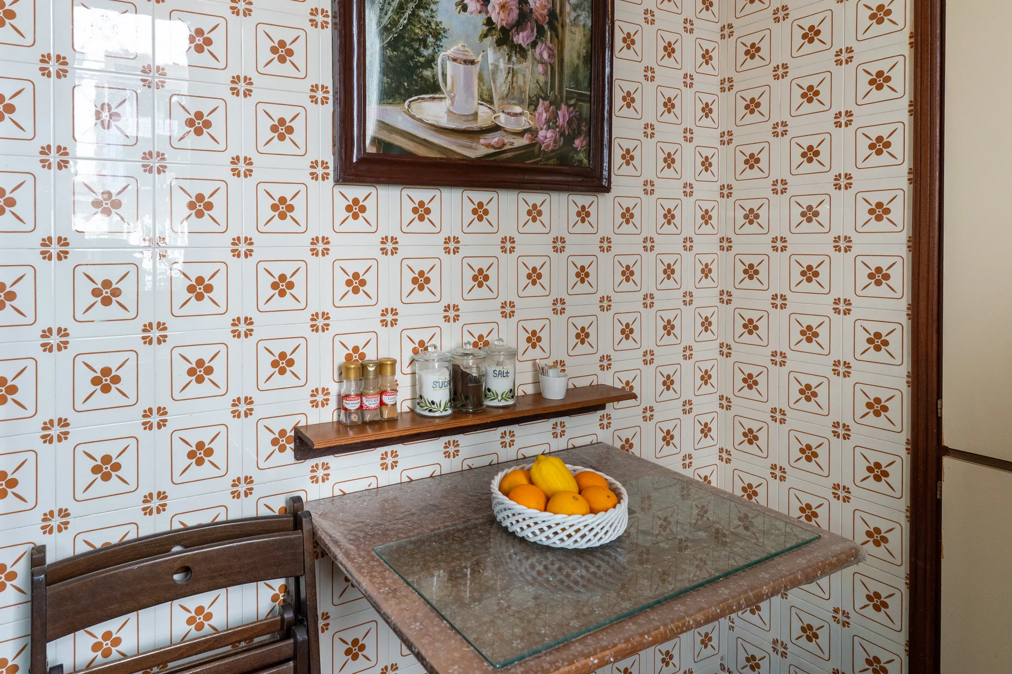 Kitchen counter and patterned tiles photographed with warm detail - interior photography on the Amalfi Coast by Cinereo