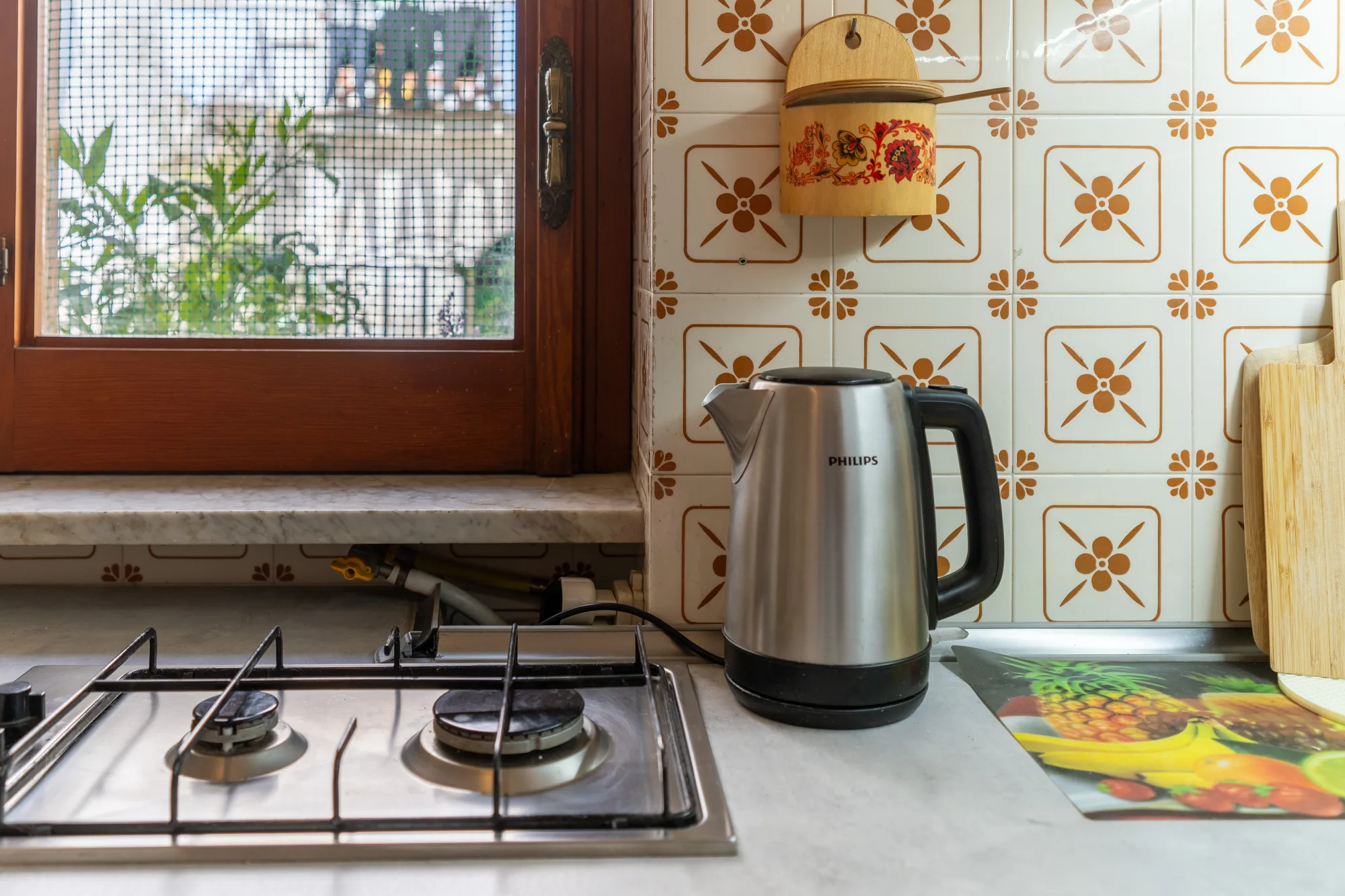 Gas hob and window light showing the practical cooking area - interior photography on the Amalfi Coast by Cinereo