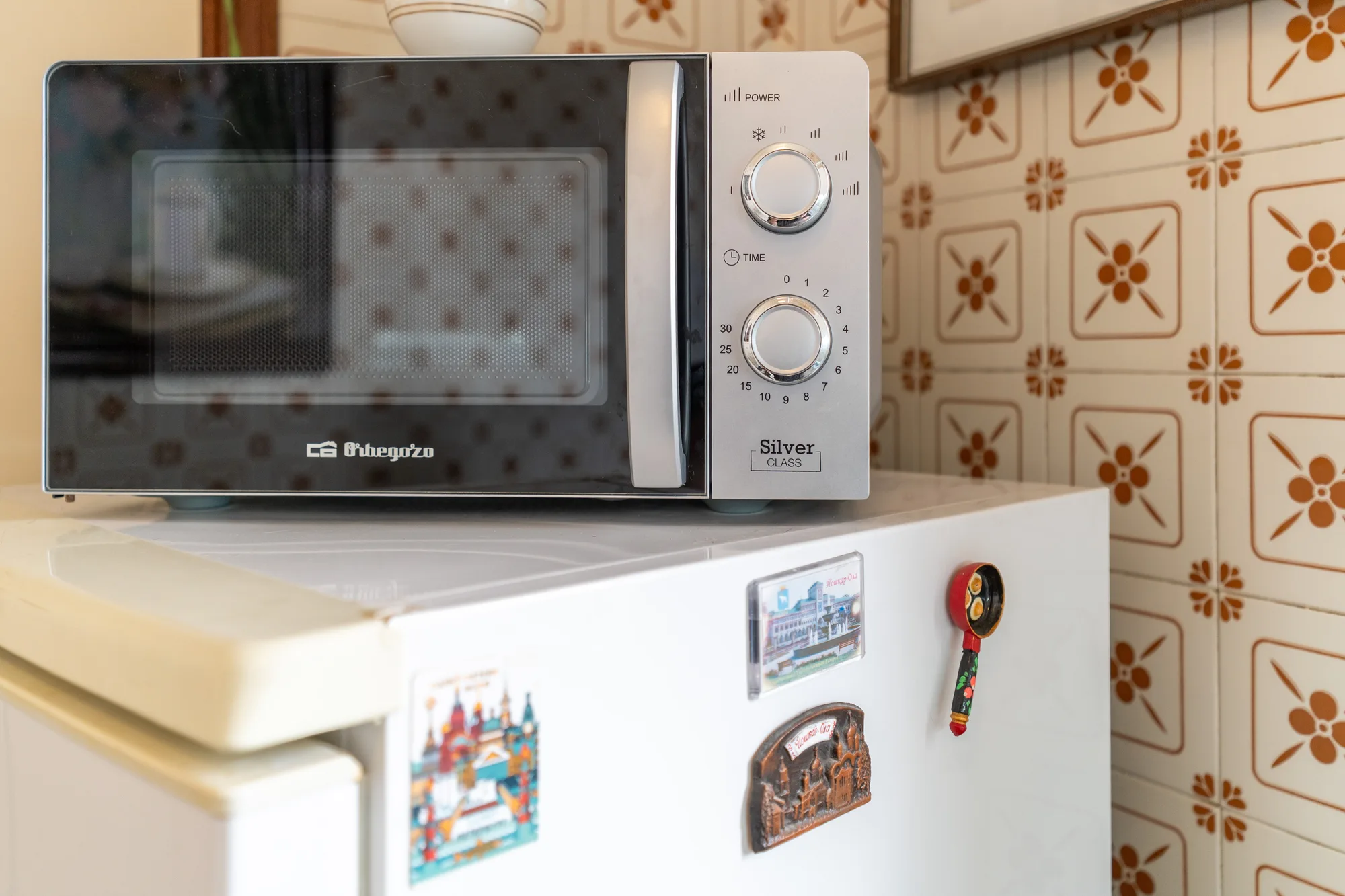 Microwave and refrigerator detail for listing transparency - interior photography on the Amalfi Coast by Cinereo