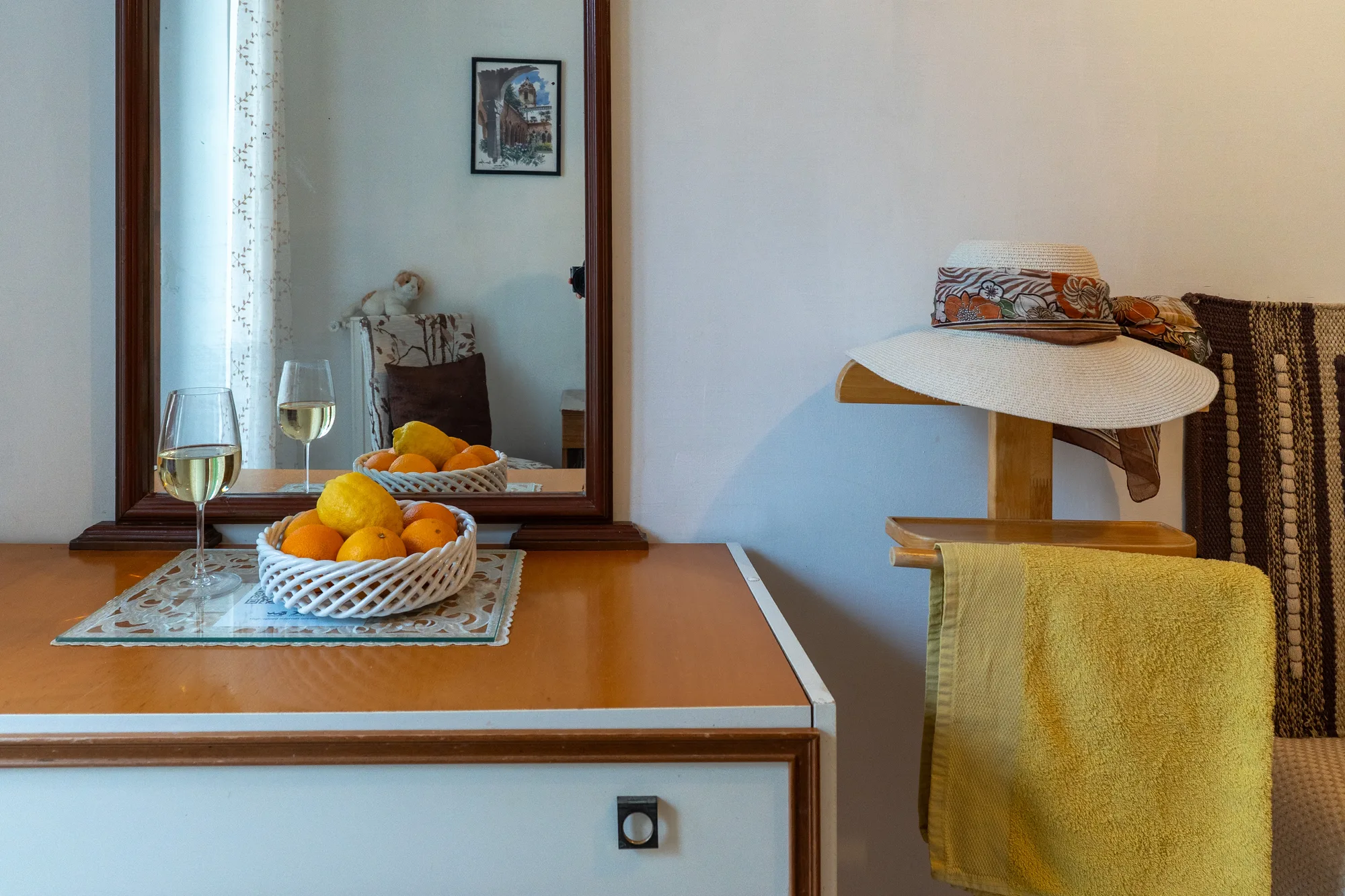 Mirror, fruit and towel detail for a clean guest welcome - interior photography on the Amalfi Coast by Cinereo