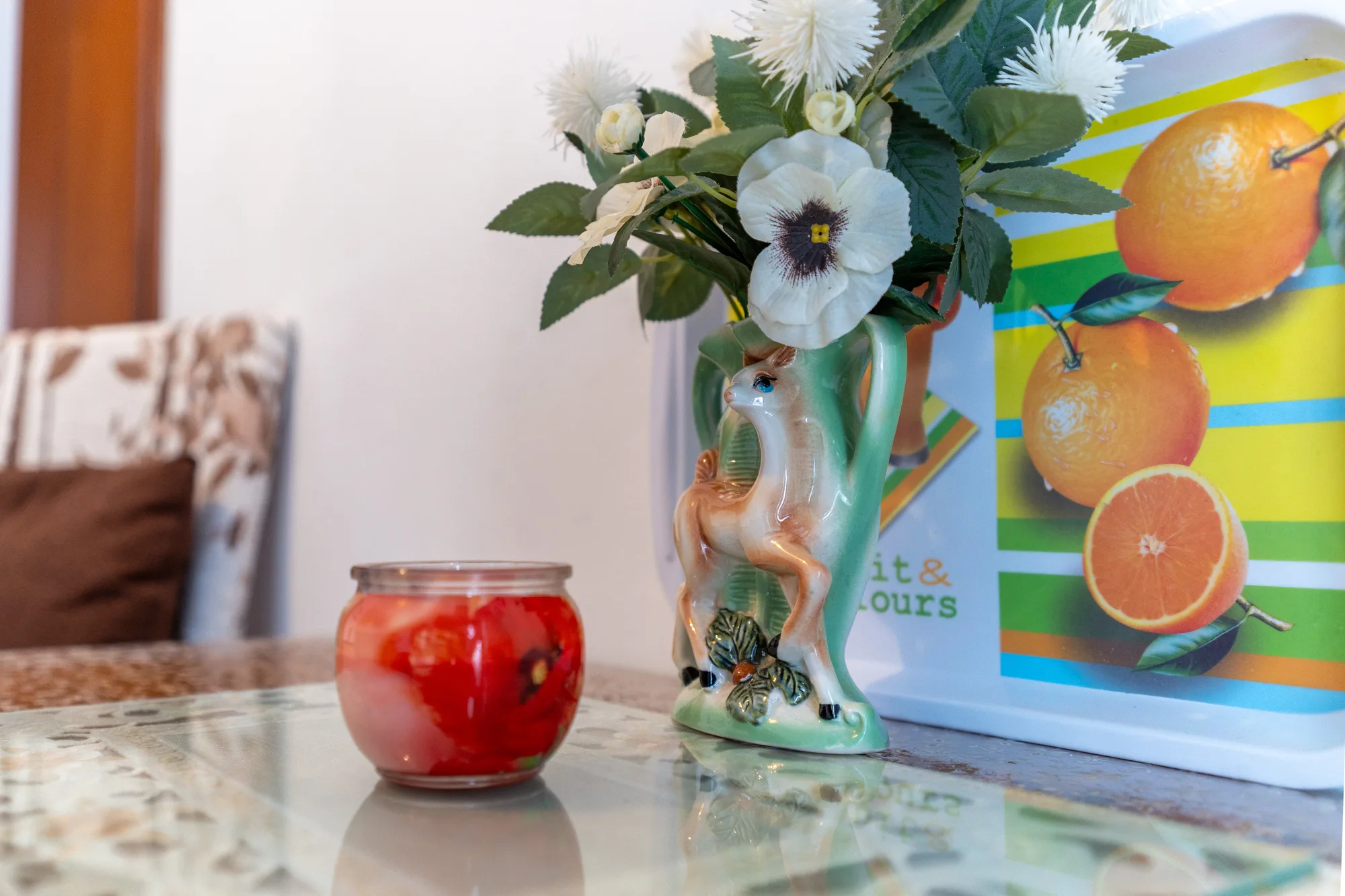 Colorful tabletop still life adding warmth to the guest room - interior photography on the Amalfi Coast by Cinereo